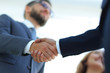 © ASDF - Successful business people handshaking after good deal.