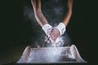 © Wavebreak Media - Male gymnast rubbing her hands with chalk powder