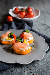 Wall Mural - Sweet potato slices topped with cream cheese, smoked salmon, olives and corn