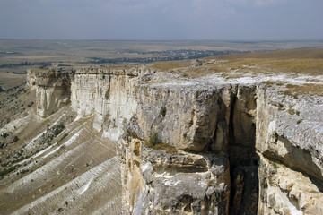 White rock or Aq Qaya on a Sunny summer day. Crimea. White limestone with a vertical cliff