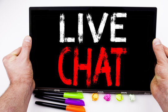 Live Chat text written on tablet, computer in the office with marker, pen, stationery. Business concept for Chatting Communication Digital Web Concept white background with copy space