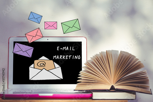 Laptop Computer On Wood Desk With Open Book And Mail - 