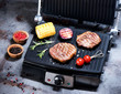 Beef steak with vegetables. Preparation on electric grill
