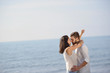 © FS-Stock - Romantic young couple on the beach kissing.
