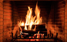 Logs Burning In A Fireplace
