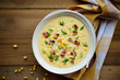 Corn chowder soup with bacon. Brown wooden background. Top view
