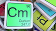 Curium Cm block on the pile of periodic table of the chemical elements blocks. 3D rendering