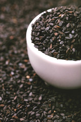 Wall Mural - Black sesame seeds. Copy space. Horizontal view.