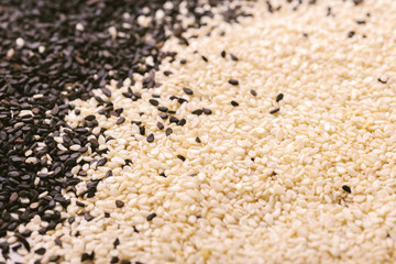 Wall Mural - Black and white sesame seeds. Copy space. Top view.