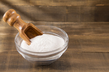 Wall Mural - baking soda (Sodium bicarbonate) on a wooden spoon