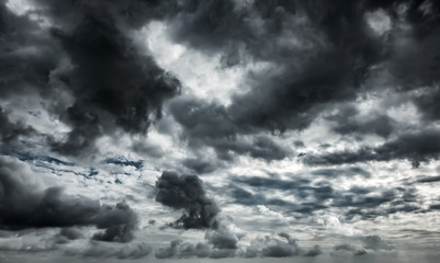 Dramatic thunderstorm clouds background at dark sky