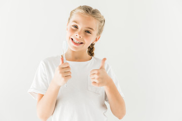 Wall Mural - child holding toothbrush