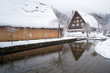 Shirakawago house with snow covered and river foreground