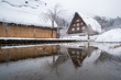 Shirakawago house with snow covered and blurred river foreground