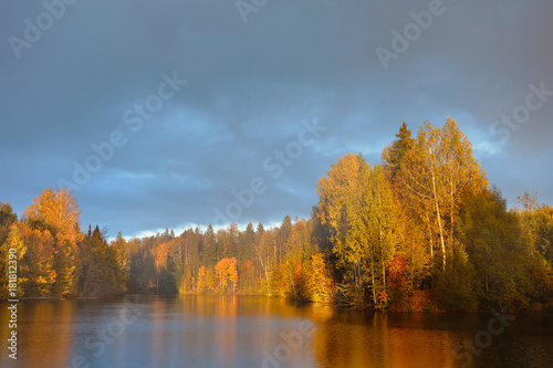 Rainbow Over Calm Water Of A Forest Lake Beautiful Clouds