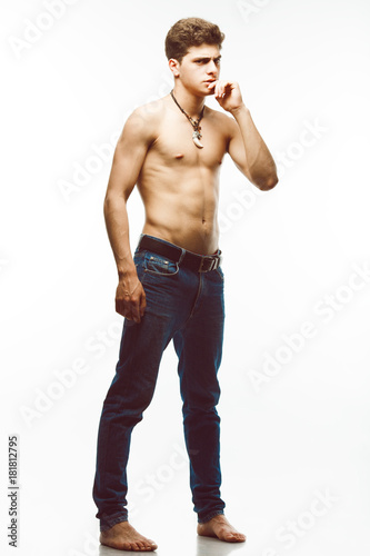 Male Beauty Blue Jeans Concept Handsome Model In Trendy Jeans With Perfect Muscular Body Posing Over White Background Leather Accessories Urban Style Full Length Portrait Buy This Stock Photo And