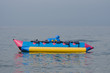 Banana boat in the middle of the sea. Banana boat is a water activities player. On vacation - I like the feel of this, might be something l try to create for my body background