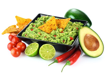 Wall Mural - Guacamole nachos and guacamole ingredients isolated on white background.