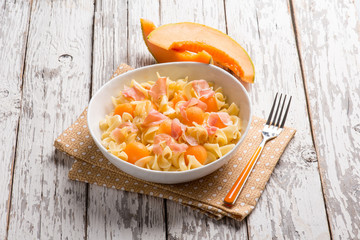 Wall Mural - pasta salad with parma ham and melon