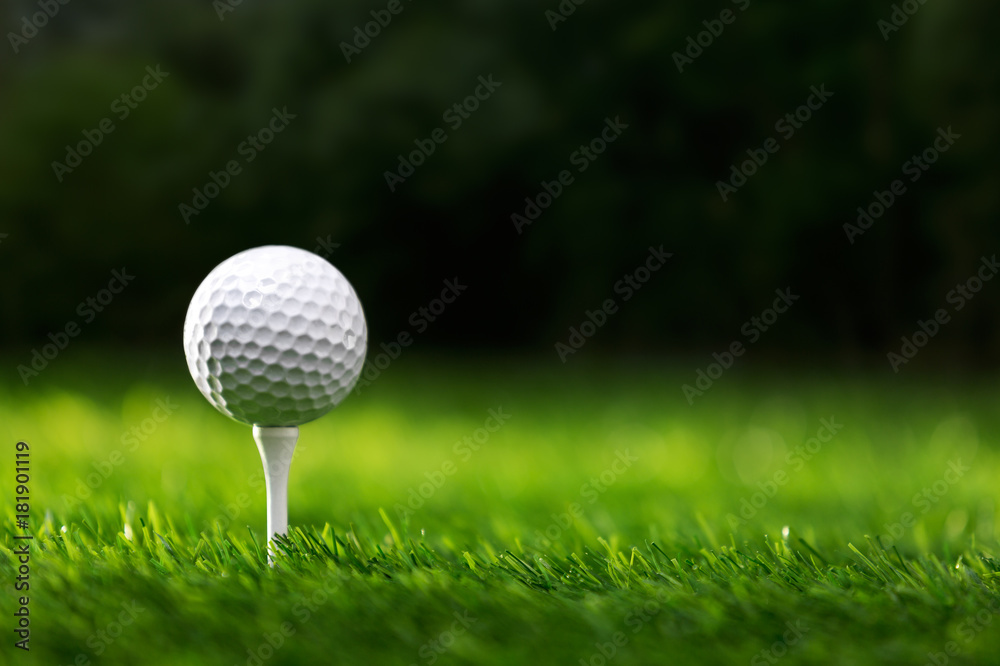 Golf ball on tee ready to be shot - obrazy, fototapety, plakaty 