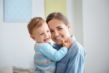 Poster - Woman with her baby at home