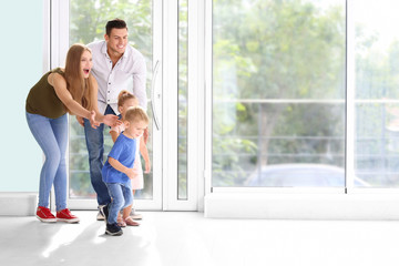 Canvas Print - Happy family in their new house