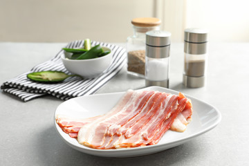 Wall Mural - Plate with rashers of bacon on table