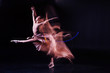 © zinkevych - Wonderful skills. Attractive nice skillful woman making a jump and doing the splits in the air while showing her flexibility