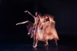 © zinkevych - Dress rehearsal. Professional nice female dancer standing on stage and doing the movements while getting ready to the performance