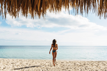 Wall Mural - Young woman relax on the beach.