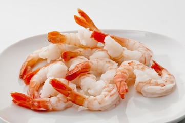 Jumbo Head Less Cooked prawns on white plate on white background