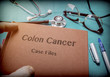  Doctor Holds Book On colon cancer In A Hospital 