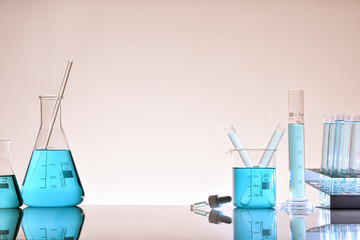 Assortment of glass containers for laboratory warm background general view