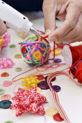 Wall Mural - man making a handmade christmas ball