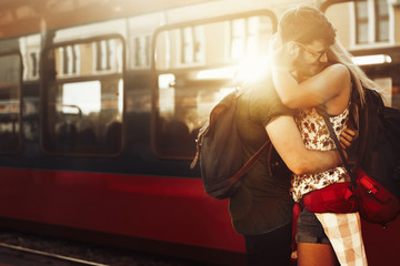 Wall Mural - Beautiful couple parting at train station