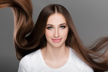  woman with shiny straight long hair. 