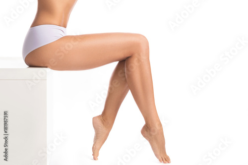 Female legs on white background Tableau sur Toile