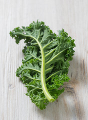 Sticker - kale on white wooden surface