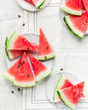  Summer time! Slices of fresh juicy red watermelon on a light white background Place for text. Flat lay, top view