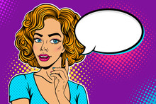 Wow Female Face. Young Sexy Surprised Blonde Woman With Open Mouth Looking At Empty Speech Bubble And Holding Hand With The Index Finger Raised. Vector Colorful Background In Pop Art Retro Comic Style