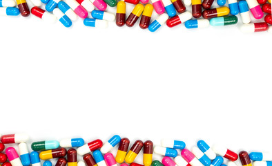 Wall Mural - Colorful of antibiotic capsules pills isolated on white background with copy space. Drug resistance concept. Antibiotics drug use with reasonable and global healthcare concept.