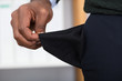 © Andrey Popov - Man Holding Empty Pocket