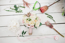 Gorgeous Wedding Bouquet Of Roses And Other Flowers Stands On The Florist's Working Table