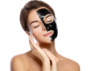 Wall Mural - Beautiful woman with a purifying black mask on her face