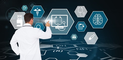 Poster - Composite image of handsome doctor pointing