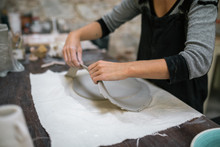 Artisan Working In Pottery Studio