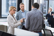 © LIGHTFIELD STUDIOS - businesspeople discussing work in office