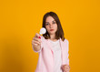© MFcreated - Young cute woman with electric bulb, studio