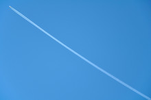 Trail From The Airplane Crossing The Blue Sky Diagonally