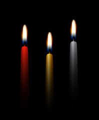 Wall Mural - set of vector three realistic burning tall candles isolated on dark background